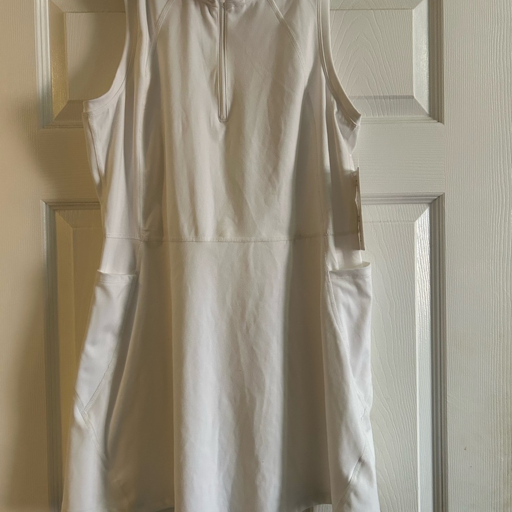 Danskin Golf dress w/ pockets. Bright white color. Size large and new with tags.